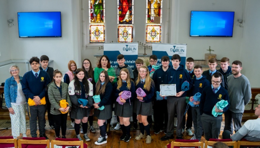 Group of students being presented with award.