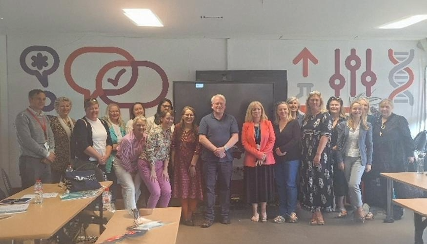 adult career guidance and information officers posing in meeting room