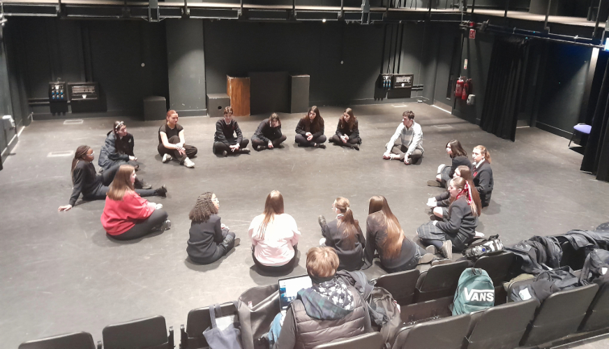 Group of students sitting in a circle