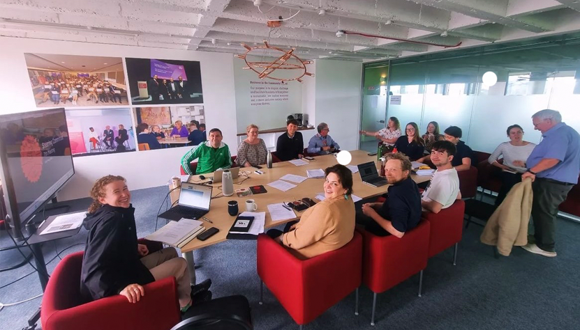 Group of people around a table at a casual meeting