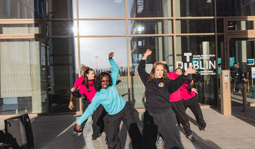 Students Dancing outside building