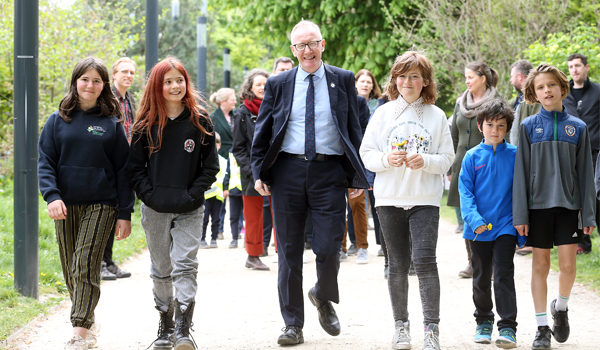 Minister of State for Public Health and Wellbeing, Frank Feighan T.D. on a morning walk with children from Dublin 7 Educate Together National School to promote Walk21 Ireland in April 2022.