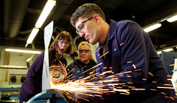 Apprenticehip students working with machinery