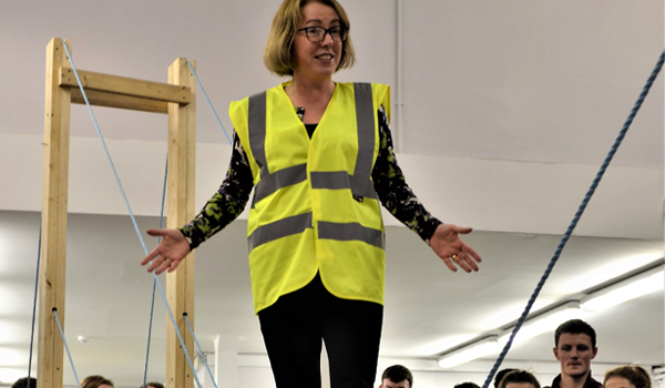 Una Beagon Demonstrating Building A Timber Structure at a Creative Design Studio