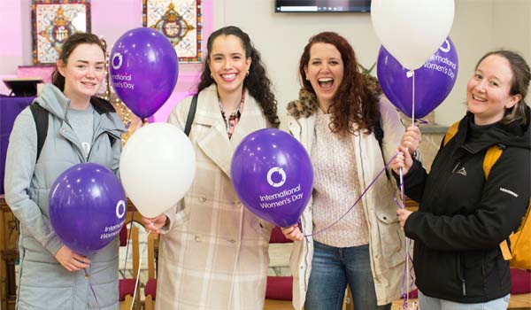 Students celebrating the Athena SWAN Ireland charter with balloons