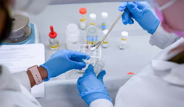 TU Dublin Chemistry Students pour a substance into test tube