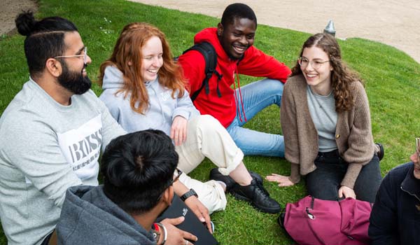 TU Dublin Students sitting on grass