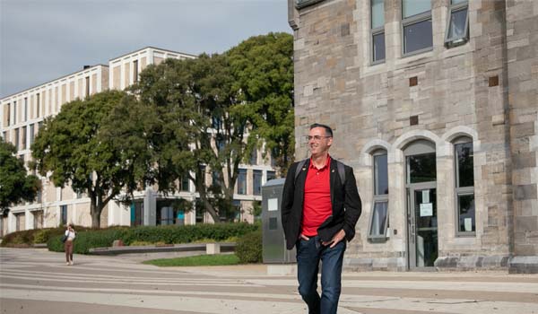 A student walking on TU Dublin's Grangegorman Campus