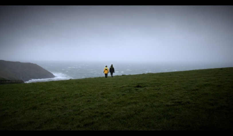 People looking out at sea