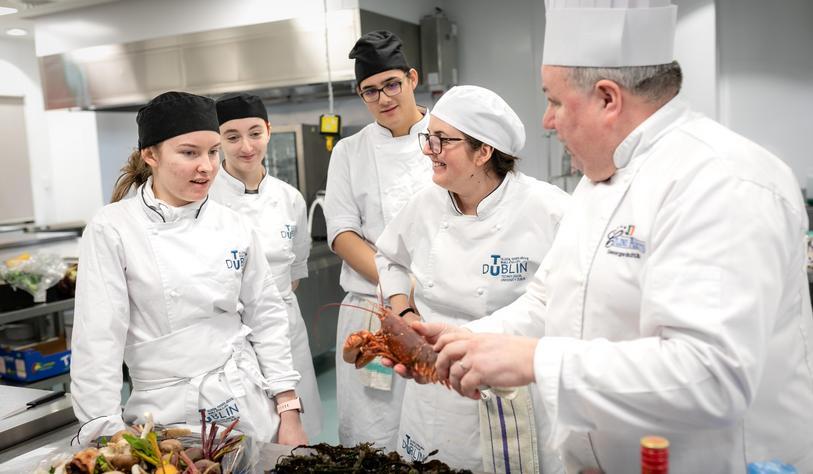 Culinary Arts students and staff working in a kitchen