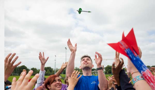 A group of people launching a rocket