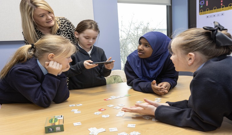 four students playing game